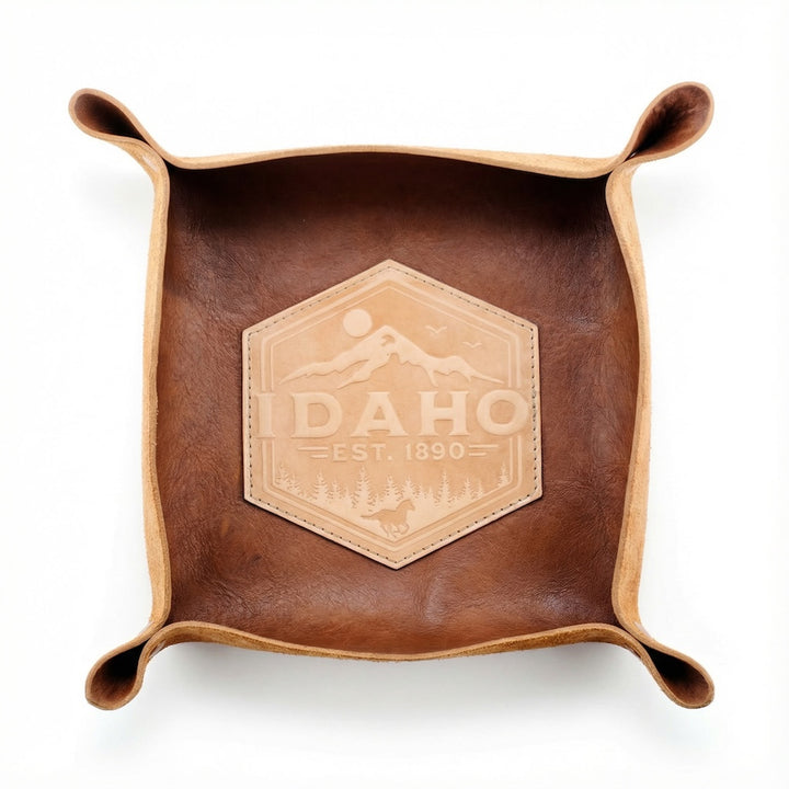 Brown leather tray with Idaho logo on a white background