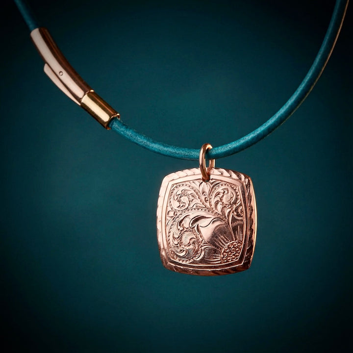 Necklace with a decorative pendant on a dark background